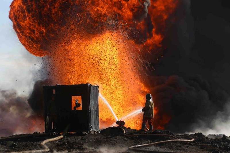 An oil fire lit by Islamic State.